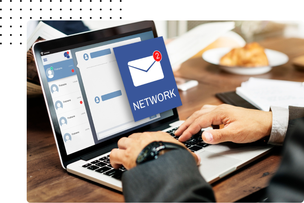 Person using a laptop with an email marketing interface showing a network notification.