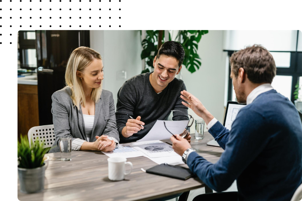 Marketing consultants analyzing campaign plans with clients during a growth strategy meeting